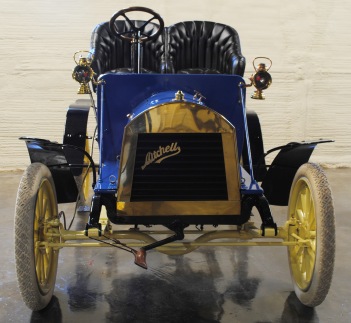 The 1906 Mitchell Runabout is shown without its top cover. Although light and without much power, when the top cover is removed, it is an exhilarating experience to go even 20 or 30 miles per hour down the road!