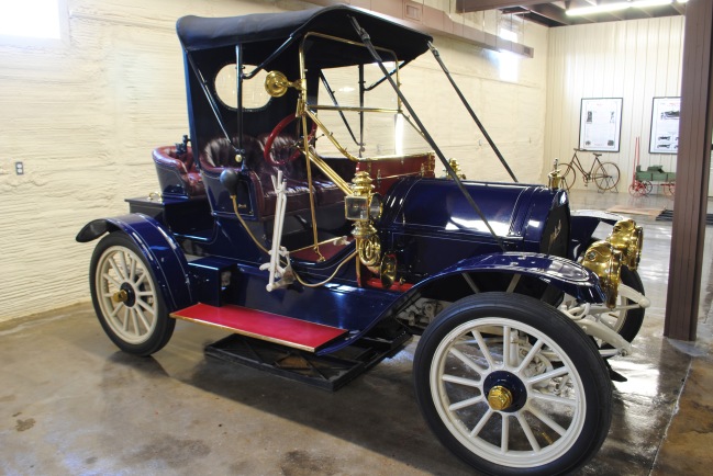 The 1911 Mitchell 3-Passenger Roadster has cushioned seats for two inside under the top cover and an open air seat on the back of the car as well. If a third person wasn’t traveling that day, the third back seat could be refitted like a trunk to carry groceries or a small suitcase for trips!
