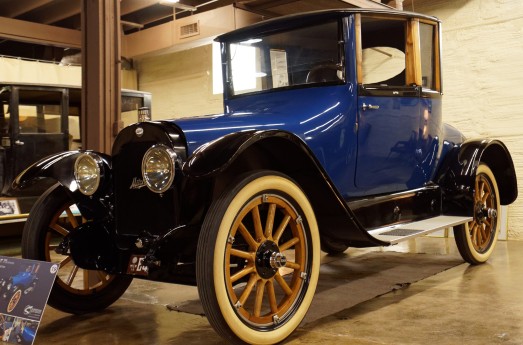 This is a 1919 3-Passenger Coupe. The top is removable, but it doesn't fold down into the car -- you have to set it on the floor of your garage.